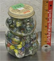 Marbles in a glass bear jar