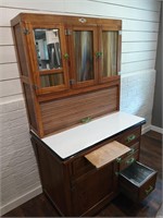 Hoosier kitchen cabinet with slag glass beveled