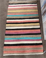 11 - STRIPED AREA RUG 59X36"