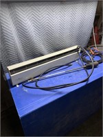 Baseboard heater, booster cables, tiger torch