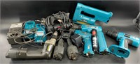 Assorted Makita power tools and a motorcycle helme