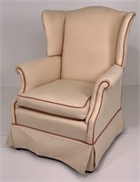 Wing chair, molded legs, tan upholstery, rolled