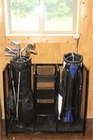 Golf bag stand and two golf bags with misc clubs