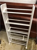 Painted white solid wood shoe rack
48 inches