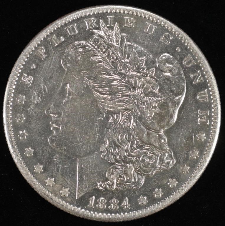 1884-S MORGAN DOLLAR AU MARKS ON REV.