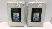 (2) Beige matching chair covers (unused)