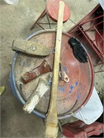 Several wooden handles and ax and hammer heads