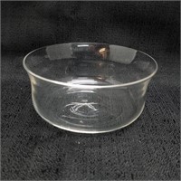 Four small clear glass bowls curved side