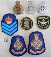 Queensland Police three metal cap badges