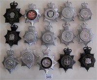 Fifteen UK Police Bobby helmet plates