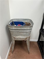 Antique wash tub stand with garden tools