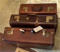 3 leather suitcases