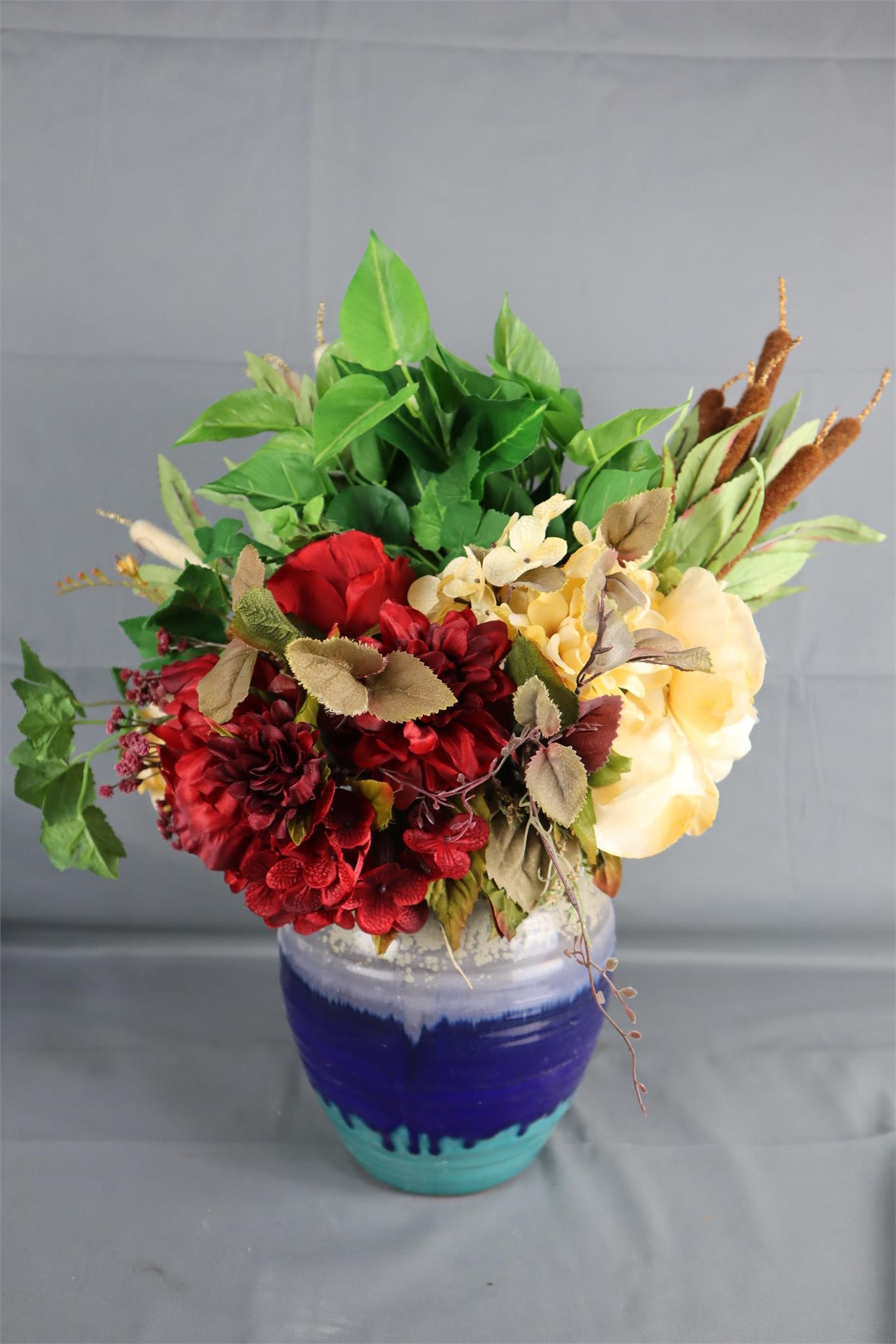 Faux Floral Arrangement in Pottery Vase