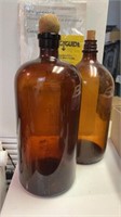 2 large Brown glass bottle one marked duraglass