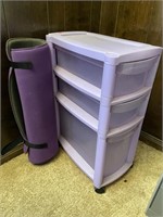 3 plastic drawers amd yoga mat