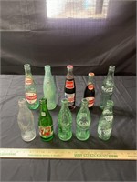 Misc glass bottles, two are full