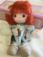 March precious moments doll