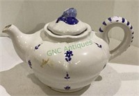 Ceramic teapot with floral motif.     1952.