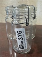 3 clear glass jars all different numbers