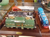 4 MOUNTED LIONEL TRAINS