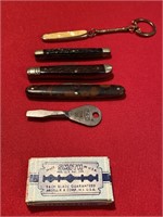 Four pocket knives and a box of double edge razor