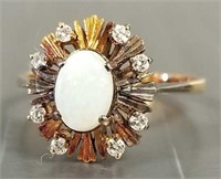 14K gold ring set with cabochon opal measuring 7 x