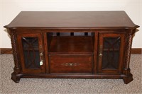 WALNUT TV STAND WITH GLASS FRONT DOORS AND DRAWER