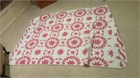 Pink machine stitched quilt