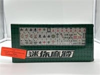 Mini mahjong tiles in box. Matching game.