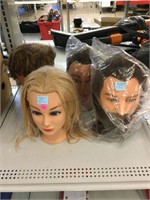 4 cosmetology mannequin heads.