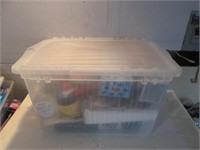 STORAGE CONTAINER FULL WITH VARIOUS ITEMS