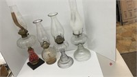 (4) vintage oil lamps ranging in sizes from