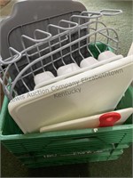 Plastic crate filled with a metal dish strainer,