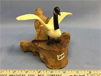 Canadian goose with wings up on a vertebrae, wings