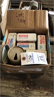 Box of old band aid tins and buckhorn can