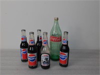 Bottles, 5 Pepsi, And One Coke Cola