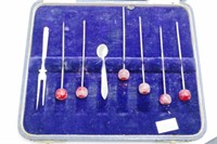 Cased set six decorated cocktail sticks