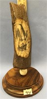 6.5" fossilized ivory tusk scrimshawed with a hunt