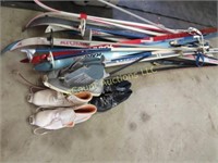 many cross country skiis and shoes poles