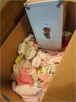 Box of doll clothes and doll box