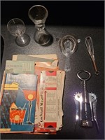 Misc. Bar utensils & recipe booklets. Basement bar