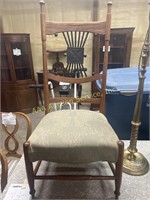Victorian chair with carved designs and