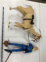 Action figure and plastic horse