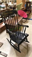 Black rocking chair with the stenciled back,