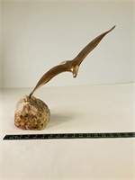 Bronze Flying Bird in stone sculpture