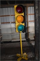 Commercial traffic light mounted on a stand with l