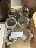 Glass jars with light up candles