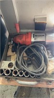 Electric impact wrench, in the storage box, with