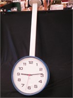 Ceiling-mounted double-sided clock marked PPP