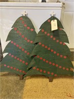 Two wooden yard decorative Christmas trees